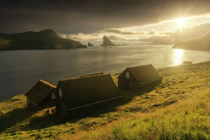 Framed Print : Some moss-covered houses with Drangarnir and Tindholmur sea stacks in the background. Vagar, Faroe Islands Framed Print : Some moss-covered houses with Drangarnir and Tindholmur sea stacks in the background. Vagar, Faroe Islands