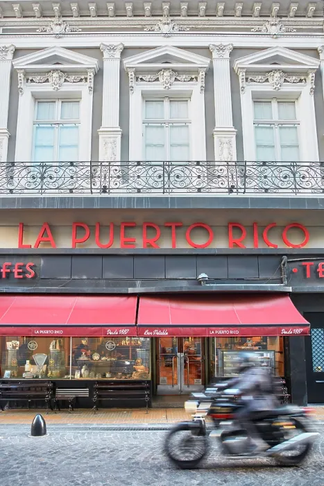 Framed Print : A motorbike passing by the exterior facade of 'La Puerto Rico' Notable Cafe, Monserrat, Buenos Aires, Argentina Framed Print : A motorbike passing by the exterior facade of 'La Puerto Rico' Notable Cafe, Monserrat, Buenos Aires, Argentina
