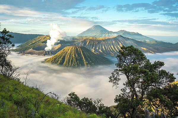 Mount Bromo, sunrise over volcano in clouds, Mount Batok, Mount Kursi, Mount Semeru, Bromo Tengger Semeru National Park, Java, Indonesia