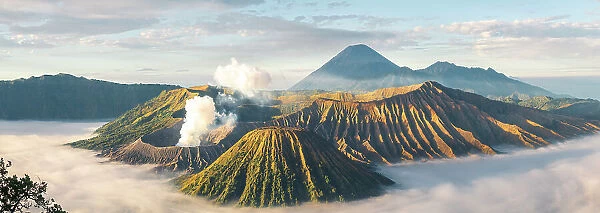 Mount Bromo, sunrise over volcano in clouds, Mount Batok, Mount Kursi, Mount Semeru, Bromo Tengger Semeru National Park, Java, Indonesia