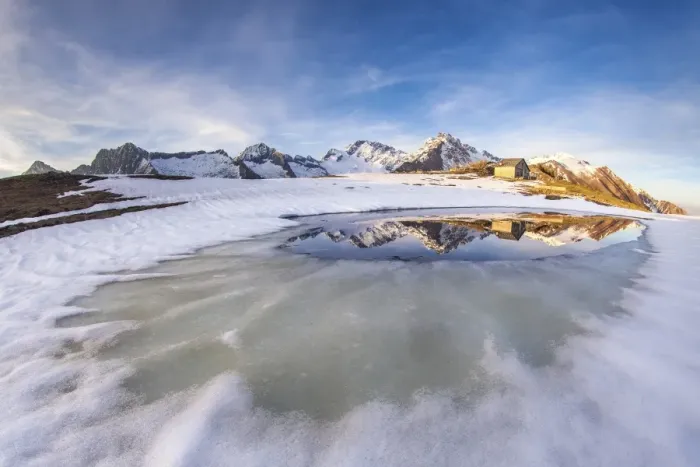 Framed Print : Mount Disgrazia and Corni Bruciati reflecting in the Lake Meltri in the thawing season Framed Print : Mount Disgrazia and Corni Bruciati reflecting in the Lake Meltri in the thawing season