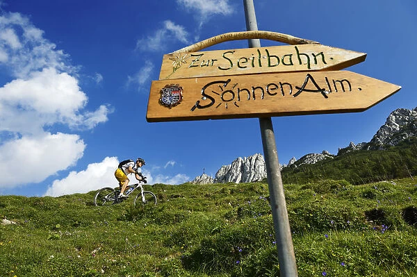 Mountain biker on the Kampenwand, Chiemgau, Upper Bavaria, Bavaria, Germany. MR