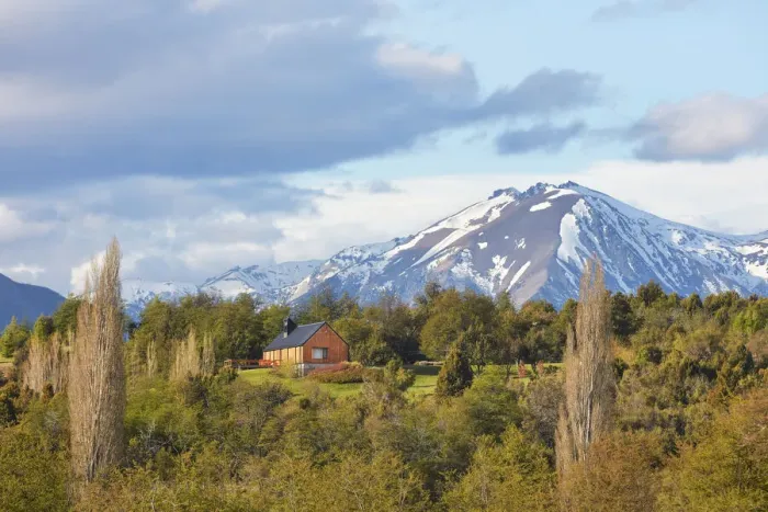 Framed Print : A mountain cabin with the Andes snowy peaks in background, near the Carrileufu River, Cholila, Chubut, Patagonia, Argentina Framed Print : A mountain cabin with the Andes snowy peaks in background, near the Carrileufu River, Cholila, Chubut, Patagonia, Argentina
