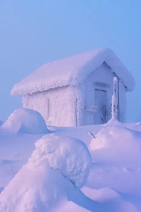 Framed Print : Mountain hut covered with snow surrounded by ice sculptures in the cold winter landscape of Finnish Lapland at dawn Framed Print : Mountain hut covered with snow surrounded by ice sculptures in the cold winter landscape of Finnish Lapland at dawn