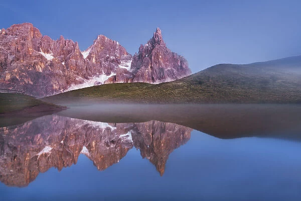 Mountain impression Reflection of Pale di San Martino in lake - Italy