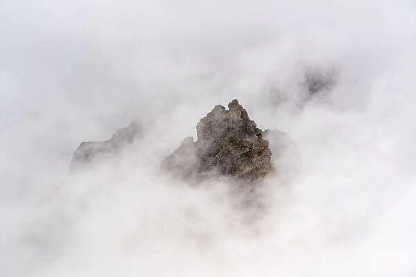 Mountain peaks surrounded by the mist at Pico do Areeiro. Funchal, Madeira Island