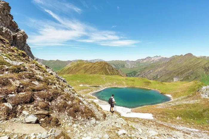 Framed Print : A mountaineer admiring Lake Ramsgrubner and the Tux alps on a summer day, Wildlahner, Schmirn Valley, Innsbruck Land, Tyrol, Austria