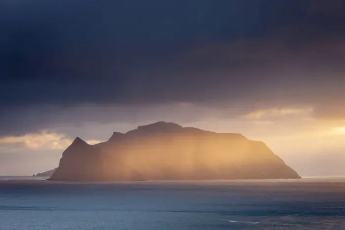 Framed Print : The mountainous island of Mykines, illuminated by a golden ray of evening sunshine Framed Print : The mountainous island of Mykines, illuminated by a golden ray of evening sunshine
