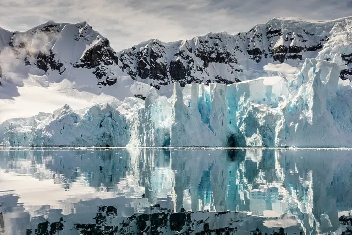Framed Print : Mountains and glacier reflected in Paradise Harbour, Antarctica Framed Print : Mountains and glacier reflected in Paradise Harbour, Antarctica