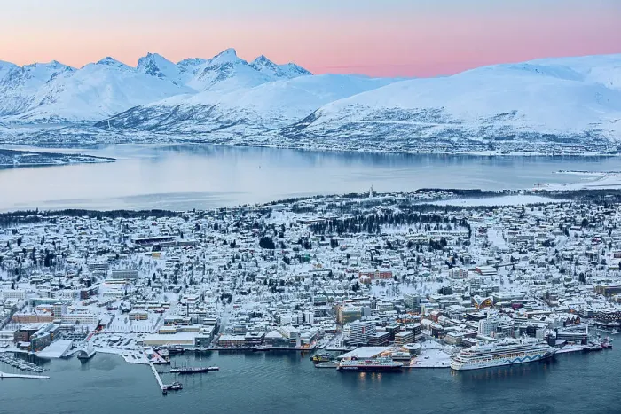 Framed Print : Mountains overlooking the frozen harbor of Tromso in winter, Norway Framed Print : Mountains overlooking the frozen harbor of Tromso in winter, Norway