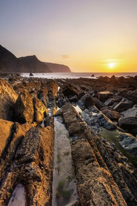 Framed Print : Mouthmill beach and Bideford Bay and Hartland at sunset, Mouthmill, North Devon, England, United Kingdom