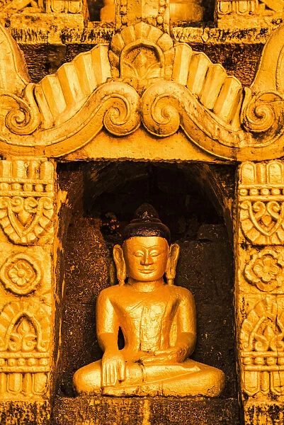 Mrauk-U, Rakhine state, Myanmar. Detail of a small Buddha statue in a stupa