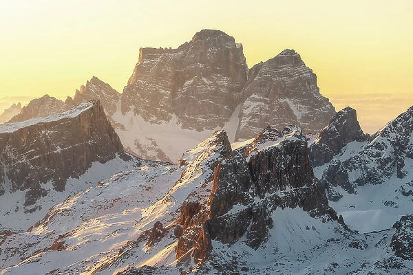 Mt. Pelmo getting the first sunlight of the day on a cold winter morning - seen from the Lagazuoi hut. Dolomites, Italy