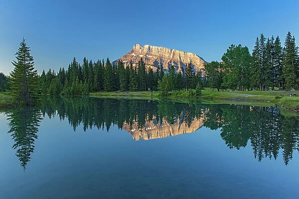 Mt. Rundle reflected in Cascade Pond at sunrise, Banff National Park, Alberta, Canada