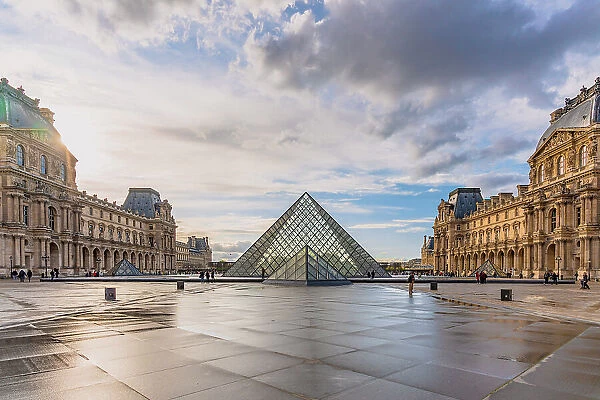 Musee du Louvre, square and famous Pyramid. Paris, France