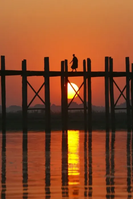 Framed Print : Myanmar (Burma), Amarapura, Taungthaman Lake, U Beins Bridge. A monk walking home at sunset over U Beins Bridge, over 200 years old and the worlds longest Framed Print : Myanmar (Burma), Amarapura, Taungthaman Lake, U Beins Bridge. A monk walking home at sunset over U Beins Bridge, over 200 years old and the worlds longest