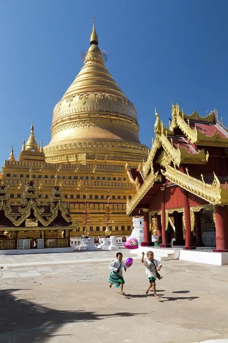 Framed Print : Myanmar, Burma, Mandalay, Bagan, Pagan, Shwezigon Pagoda, Boys running with balloons at Shwezigon Paya Framed Print : Myanmar, Burma, Mandalay, Bagan, Pagan, Shwezigon Pagoda, Boys running with balloons at Shwezigon Paya