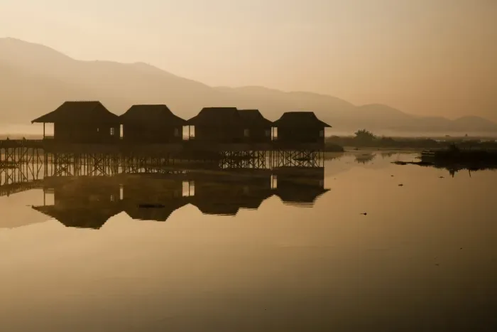 Framed Print : Myanmar, Inle Lake. A misty dawn at Golden Island Cottages, a resort for tourists owned by the Pa-O people, a collection of comfortable wooden huts on stilts