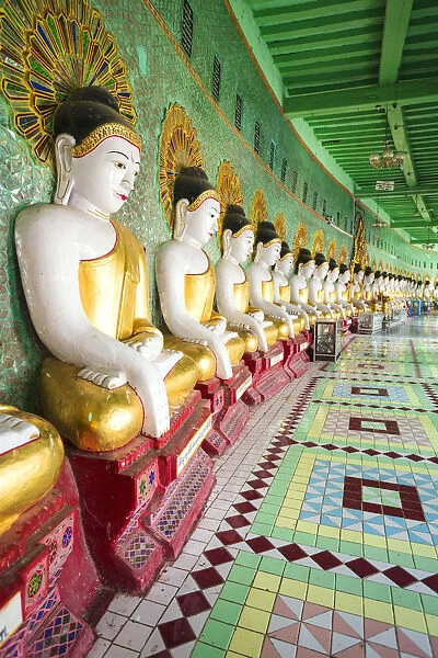 Myanmar, Mandalay. Sagaing Hil, Buddha statues inside Umin Thounzeh temple