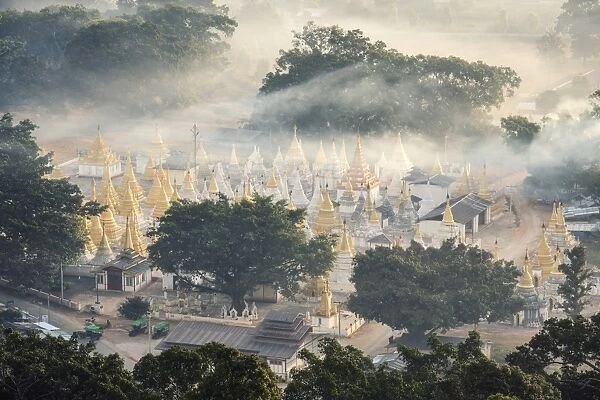 Myanmar, Shan state, Pindaya. Nget Pyaw Taw Pagoda at sunrise, elevated view