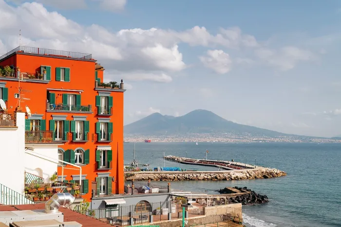 Framed Print : Naples, Italy: Colorful architecture meets the sea, with Mount Vesuvius in the distance. Posillipo Framed Print : Naples, Italy: Colorful architecture meets the sea, with Mount Vesuvius in the distance. Posillipo