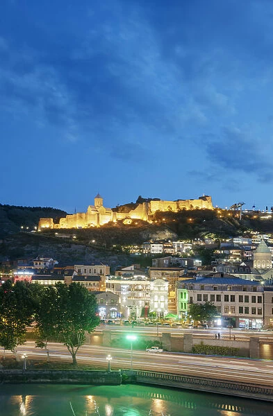 Narikala fortress above the Old Town and Mtkvari river, at dusk. Tbilisi, Georgia