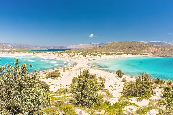 The narrow stretch of white sand which divides Simos beach viewed from a ridge