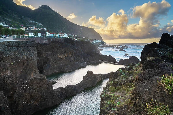 Natural volcanic rock swimming pools at sunset, Porto Moniz, Madeira, Portugal
