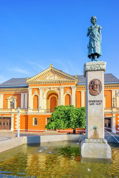 Framed Print : The Neoclassical Klaipeda Drama Theatre with the Annie from Tharau Statue, Klaipeda, Lithuania Framed Print : The Neoclassical Klaipeda Drama Theatre with the Annie from Tharau Statue, Klaipeda, Lithuania