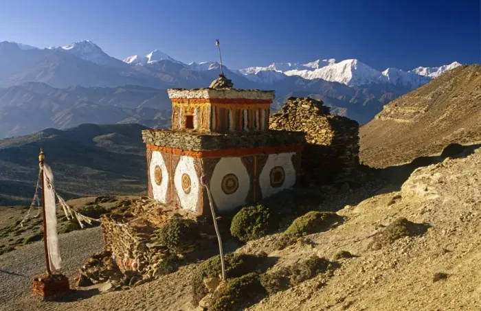 Framed Print : Nepal, Himalaya, Mustang. A decorative chorten, or Buddhist shrine, known as Chhyungkar guards the trail near Syangboche hamlet and the Syangboche Pass while the massive Annapurna massif frames