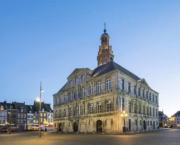 Netherlands, Limburg, Mstricht. Stadhuis city hall on Markt square at dusk