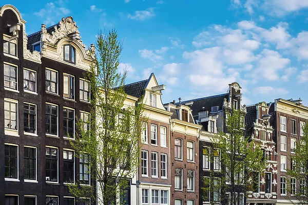 Netherlands, North Holland, Amsterdam. Facades of canal houses on Oudezijds Voorburgwal