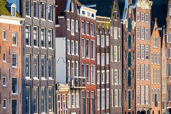 Netherlands, North Holland, Amsterdam. Crooked facades of canal houses on Damrak