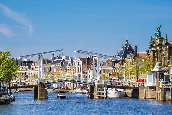 Netherlands, North Holland, Haarlem. Gravestenenbrug drawbridge and buildings on the