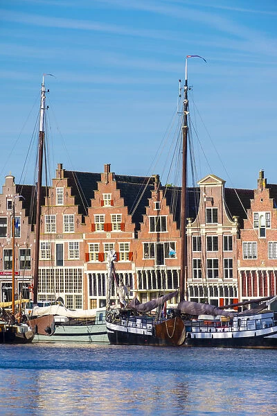 Netherlands, North Holland, Hoorn. Historic ships and buildings on the Binnenhaven harbor