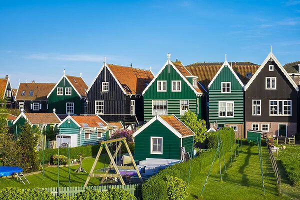 Netherlands, North Holland, Marken. Wooden houses along the harbor in Havenbuurt