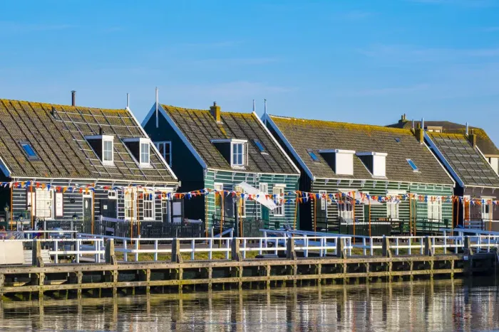 Framed Print : Netherlands, North Holland, Marken. Wooden buildings along the harbor in Havenbuurt Framed Print : Netherlands, North Holland, Marken. Wooden buildings along the harbor in Havenbuurt
