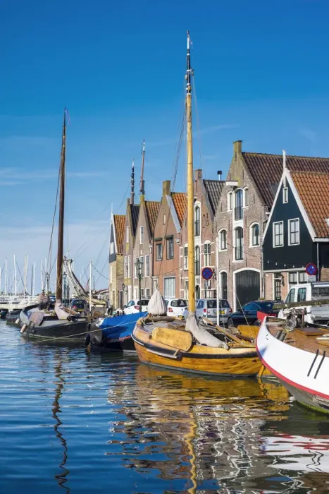 Framed Print : Netherlands, North Holland, Monnickendam. Buildings and boats along the harbor quay