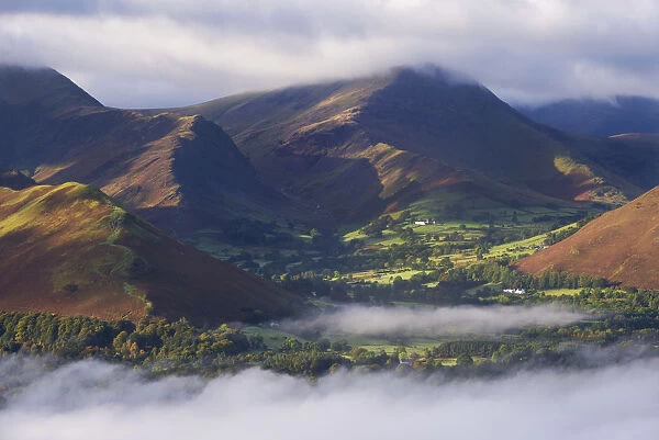 Newlands Valley surrounded by mist at dawn, Lake District, Cumbria, England. Autumn