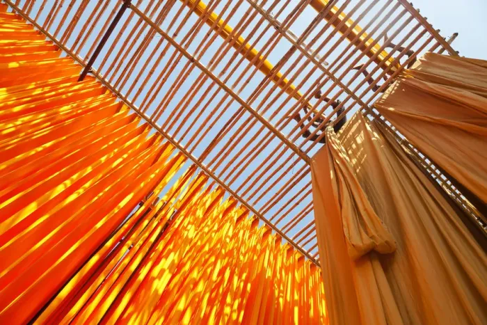 Framed Print : Newly dyed fabric being hung up to dry, Sari garment factory, Rajasthan, India, (MR / PR) Framed Print : Newly dyed fabric being hung up to dry, Sari garment factory, Rajasthan, India, (MR / PR)