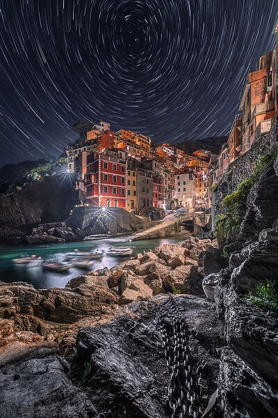 Night and Startrail on the village of Riomaggiore, Cinque Terre