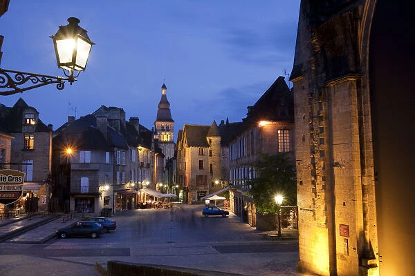 A night time cafe scene on the main square in Sarlat France