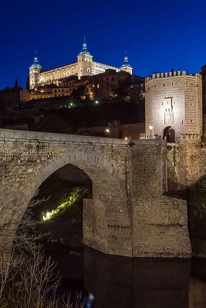 Night view of the Alcazar and Puente de Alcantara, Toledo, Castile