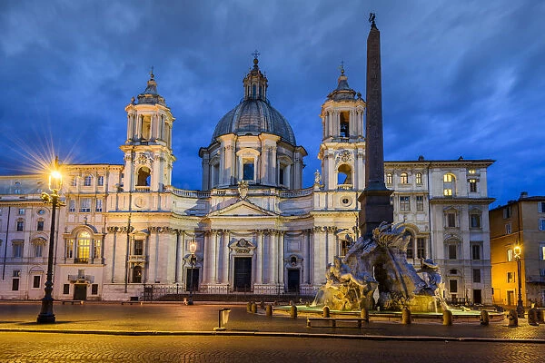 Night view of Piazza Navona with Church of Sant Agnese in Agone and Fountain