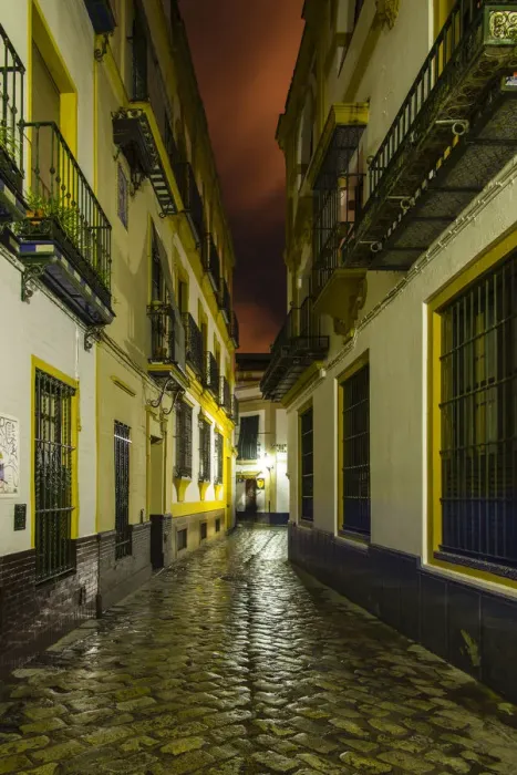 Framed Print : Night view of an empty street in Barrio Santa Cruz, Seville, Andalusia, Spain
