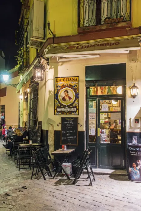 Framed Print : Night view of a tapas bar in Santa Cruz neighborhood, Seville, Andalusia, Spain