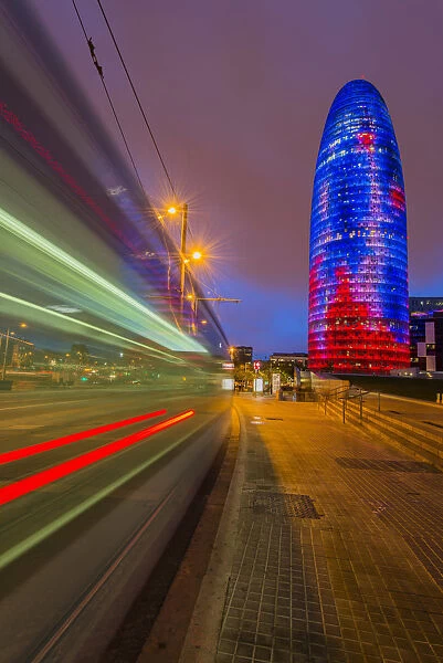 Night view of Torre Agbar skyscraper designed by French architect Jean Nouvel, Barcelona