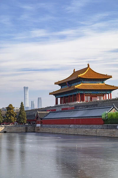 North Gate and moat of Forbidden City with CITIC Tower in background, Beijing, China