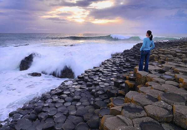 Northern Ireland, County antrim, Giants causeway, woman looking at sea