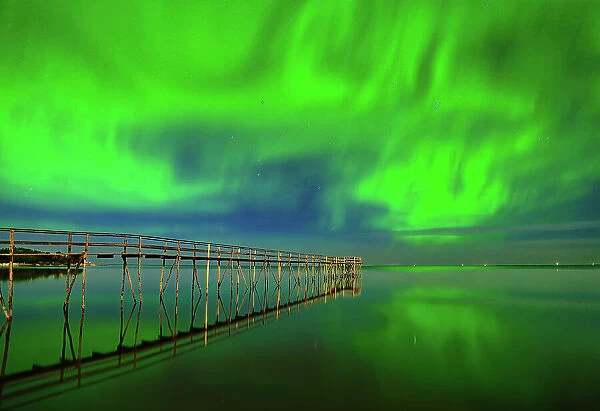 Northern lights (aurora borealis) reflected in Lake Winnipeg Matlock, Manitoba, Canada